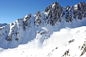 Image showing Mountain scenery with ski tracks