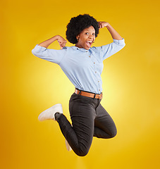 Image showing Jump, muscle flex and portrait of black woman on yellow background with energy, happiness and smile in studio. Success mockup, celebration and isolated happy girl jumping for freedom, winning and joy