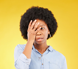 Image showing Frustrated, stress and angry with black woman in studio for tired, exhausted and mental health. Failure, bored and scared with female isolated on yellow background for difficulty, trouble and fear