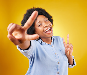 Image showing Black woman, peace sign and happy portrait in studio excited, smile and positive on a yellow background. African female model with hand, icon or happiness emoji for freedom, motivation and self love