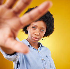 Image showing Portrait, beauty and selfie of black woman in studio isolated on a yellow background. Face, photographer or serious female or girl taking pictures or photo for profile picture, social media or memory