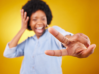 Image showing Happy, peace sign and hand of a black woman in studio with a positive and goofy mindset. African female model posing with finger gesture while happy about motivation or victory on yellow background