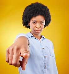 Image showing Hand, pointing and portrait of black woman in studio for you, choice or deciding on yellow background. Face, emoji and finger of suspicious lady with warning, guilty or blame, sign or accountability