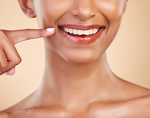 Image showing Closeup, smile and mouth of woman in studio for dental, cleaning and hygiene treatment on brown background. Zoom, lips and teeth whitening for happy girl smiling after veneers, braces or oral care