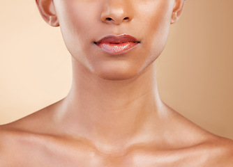 Image showing Skincare, face and mouth of a woman with a glow isolated on a studio background. Beauty, makeup and a girl glowing from cosmetics, healthy skin and results from dermatology treatment on a backdrop
