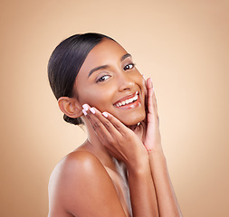 Image showing Portrait, beauty and a happy model woman in studio on a beige background for natural skincare. Face, smile and aesthetic with an attractive young female posing for cosmetics or luxury wellness