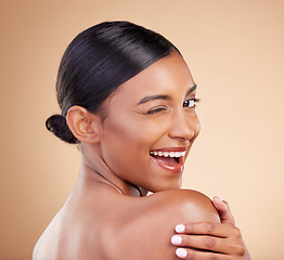 Image showing Indian woman, beauty and skincare portrait with wink, smile and looking over shoulder with wellness. Young asian model, comic gen z girl and cosmetics for natural skin glow, aesthetic and happiness