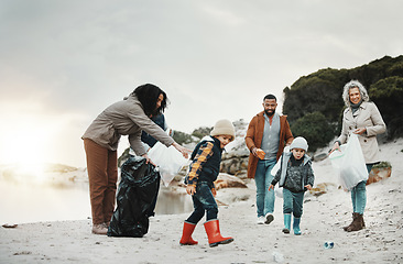 Image showing Beach cleaning, trash and children, family or volunteering group in education, learning and community support. Grandparents, people and kids helping with plastic waste or garbage for pollution action