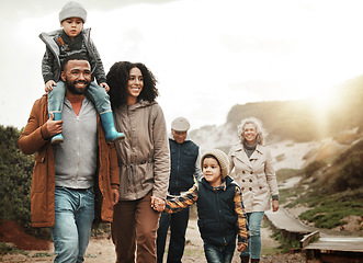 Image showing Family hiking outdoor, together with nature and happiness, bonding and spending quality time with fitness and generations. Grandparents, parents and children walking, love and care with happy people