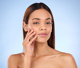 Image showing Skincare, makeup and portrait woman beauty with smooth clear skin after cosmetic treatment or facial isolated in a studio blue background. Soft, natural and clean serious model due to dermatology