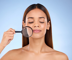 Image showing Magnifying glass, woman and face in studio for skincare analysis, dermatology and laser cosmetics. Facial magnifier, female model and beauty of aesthetics, healthy wellness check pores for acne scars