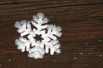 Image showing Snowflake on a wood background