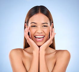 Image showing Skincare, beauty and cosmetics, portrait of happy woman with smile for anti aging or skin glow promo on blue background. Makeup, facial massage and face of model with dermatology promotion in studio.