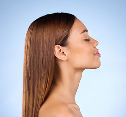 Image showing Skincare, cosmetics and profile of woman in studio with skin promo on blue background. Makeup, facial and face of beauty model from Brazil for dermatology or haircare promotion and mockup.