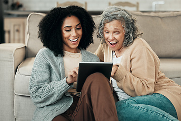 Image showing Tablet, daughter or happy senior mother laughing at funny comedy meme, online joke or enjoy quality time together at home. Living room floor, internet and biracial family, people or mom and girl bond