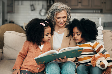 Image showing Family children, book and grandma reading fantasy storybook, story or bond on home living room sofa. Love, grandma babysitting and elderly woman with child development for biracial kindergarten kids