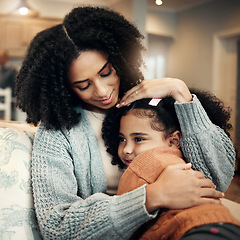 Image showing Family, love or kid hug mother for Mothers Day, home bonding or embrace on living room couch. Care, custody and biracial mom, mama or woman with female youth child, girl or daughter on apartment sofa