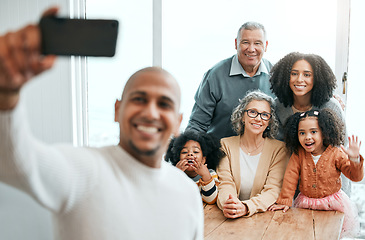 Image showing Selfie, happy family and man taking picture of people on vacation or holiday home to update social media or the internet. Group, photo and father relax with children, grandparents and mother