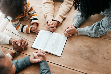 Image showing Bible, reading book or hands of family in prayer, support or hope in Christianity home for worship together. Mother, father or grandparents studying, praying or learning God in religion with children