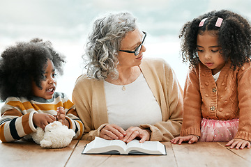 Image showing Bible, reading book or grandma with children for worship, support or hope in Christianity for education. Kids siblings, grandmother or old woman studying, praying or learning of God in religion