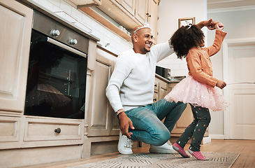 Image showing Child, ballet dance twirl and happiness of girl and father together bonding with dancing in the kitchen. Home, kid and dad with parent love and care in a house playing a dancer game for children fun