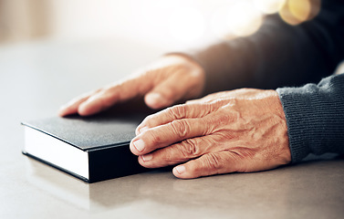 Image showing Bible book, worship or hands of old man for holy prayer, support or hope in Christianity or faith. Believe, zoom or catholic senior person praying to God in spiritual literature in religion or belief