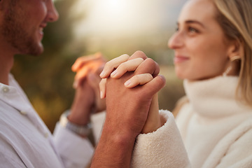 Image showing Love, smile and couple holding hands at sunset for bonding, quality time and romantic weekend. Dating, honeymoon and man and woman with palms together for trust, support and loving for valentines day