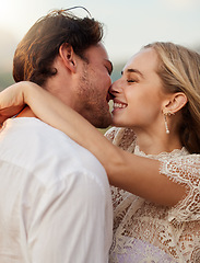 Image showing Couple, kiss and hug outdoor with a smile, love and romance on date in nature. Young man and woman happy together on valentines day with trust, peace and freedom or support in forest for anniversary