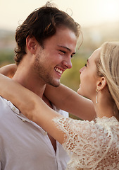 Image showing Couple, love and hug outdoor with a smile, care and romance on a date in nature. Young man and woman happy together on valentines day with trust, peace and freedom or support with a smile in forest