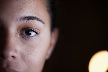 Image showing Looking, dark and portrait of a woman in the office for a deadline, overtime and working late. Mockup, serious and half face of an employee in the workplace at night for work and corporate dedication