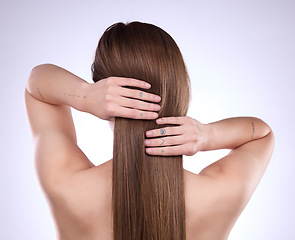 Image showing Back, beauty hands and hair care of woman in studio isolated on a gray background. Texture, cosmetics balayage and female model with salon treatment for healthy keratin, growth and straight hairstyle