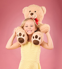 Image showing Teddy bear, girl smile and portrait with a soft toy with happiness and love for toys in a studio. Isolated, pink background and a young female child feeling happy, joy and cheerful with plaything