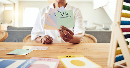 Image showing Education, letter and cards with hands of black woman for teaching, alphabet and language. Homework, lesson and study with tutor at home for learning, reading and phonics schoolwork