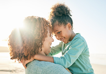 Image showing Family, mother and child hug at beach, travel and summer with sunshine lens flare and together outdoor. Trust, support with woman and girl smile on vacation, love and care in nature with happiness