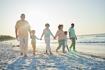 Image showing Family, grandparents and children at beach, holding hands and jump with swing, happiness or bonding on holiday. Parents, kids and senior people for love, vacation or summer sunshine in morning by sea