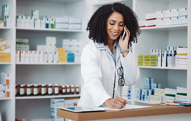 Image showing Phone call, counter and pharmacist woman for medicine note, customer service or virtual healthcare support. Happy, friendly doctor, medical retail person in pharmacy talking on cellphone at help desk