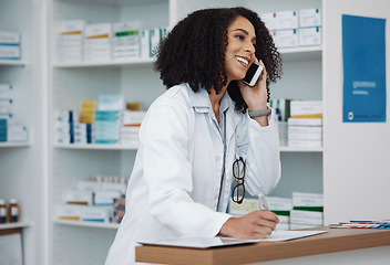 Image showing Phone call, counter and pharmacy woman for medicine, customer service or virtual healthcare support. Happy, friendly and expert doctor, medical person or pharmacist talking on cellphone at help desk