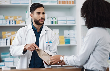 Image showing Medicine, prescription and explaining with a pharmacist man talking to a woman customer for healthcare. Medication, consulting and insurance with a male health professional working in a pharmacy