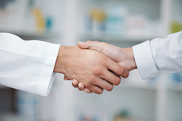 Image showing Doctor, handshake and partnership in support at pharmacy for healthcare success, promotion or deal at clinic. Medical expert shaking hands in teamwork for life insurance, b2b or pharmaceutical needs