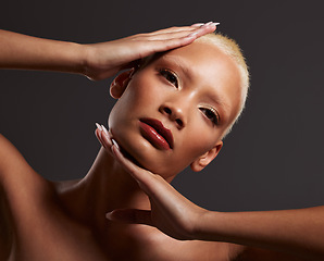 Image showing Beauty, makeup and black woman with hands on face in dark studio, platinum hair isolated on grey background. Art aesthetic, cosmetics and African skincare model and luxury spa facial for bronze skin.