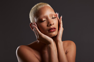 Image showing Beauty, makeup and skincare, black woman with cosmetics in dark studio with platinum hair style isolated on grey background. Art, aesthetic and relax, African model in skin glow and luxury spa facial