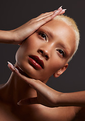 Image showing Skincare, makeup and black woman with hands on face in dark studio, platinum hair isolated on grey background. Art aesthetic, cosmetics and African beauty model and luxury spa facial for bronze skin.