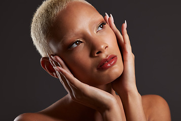 Image showing Beauty, makeup and cosmetics, black woman looking up in dark studio with platinum hair isolated on grey background. Art aesthetic, cosmetics and beautiful African model in skin glow and luxury facial