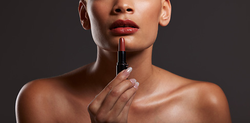 Image showing Beauty, makeup and lips of woman with lipstick in studio for cosmetics, skincare products and fashion. Salon aesthetic, cosmetology and girl model with red gloss for beauty, mouth and luxury style