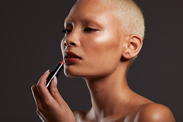 Image showing Beauty, makeup and face of woman with lipstick in studio for cosmetics, skincare products and fashion. Salon aesthetic, cosmetology and girl model with red gloss for lips, self love and luxury style