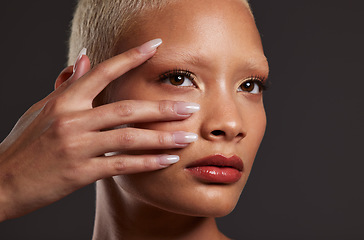 Image showing Makeup, beauty and face of woman with manicure in studio for skincare products, cosmetics and wellness. Salon aesthetic, cosmetology and girl model for nails, self love and luxury on dark background