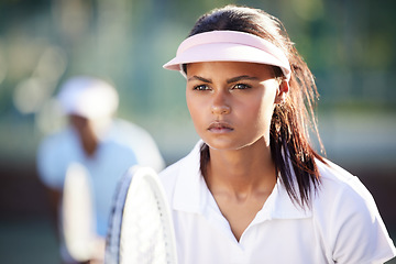 Image showing Serious, fitness and tennis with woman on court for focus, training and sports workout. Competition match, exercise and games with female athlete playing for strong, summer and concentration