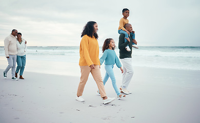 Image showing Grandparents, parents and children walking on beach enjoying holiday, travel vacation and weekend together. Big family, smile and happy people holding hands for bonding, quality time and relax by sea