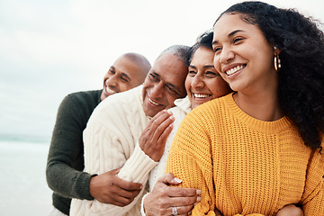 Image showing Love, happy family and hug at a beach by siblings with mature parents on holiday, smile and bonding. Hugging, care and affection by senior couple on retirement vacation while embracing adult children