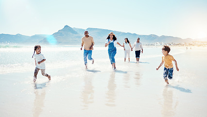 Image showing Family, beach and parents play with children for bonding, quality time and adventure by sea. Travel, running and happy mother, father and kids with grandparents on summer holiday, vacation and relax